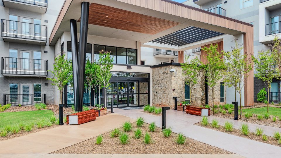 the entrance to a modern apartment building at The BroadVue